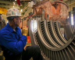 Engineer Michael Macek troubleshoots an outage at a power plant.