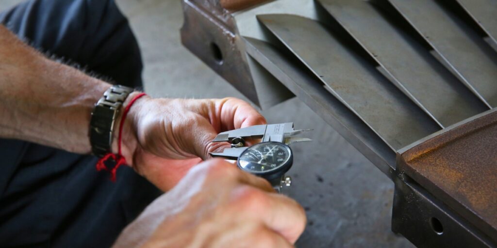 Engineer Michael Macek uses a tool in a steam path audit.